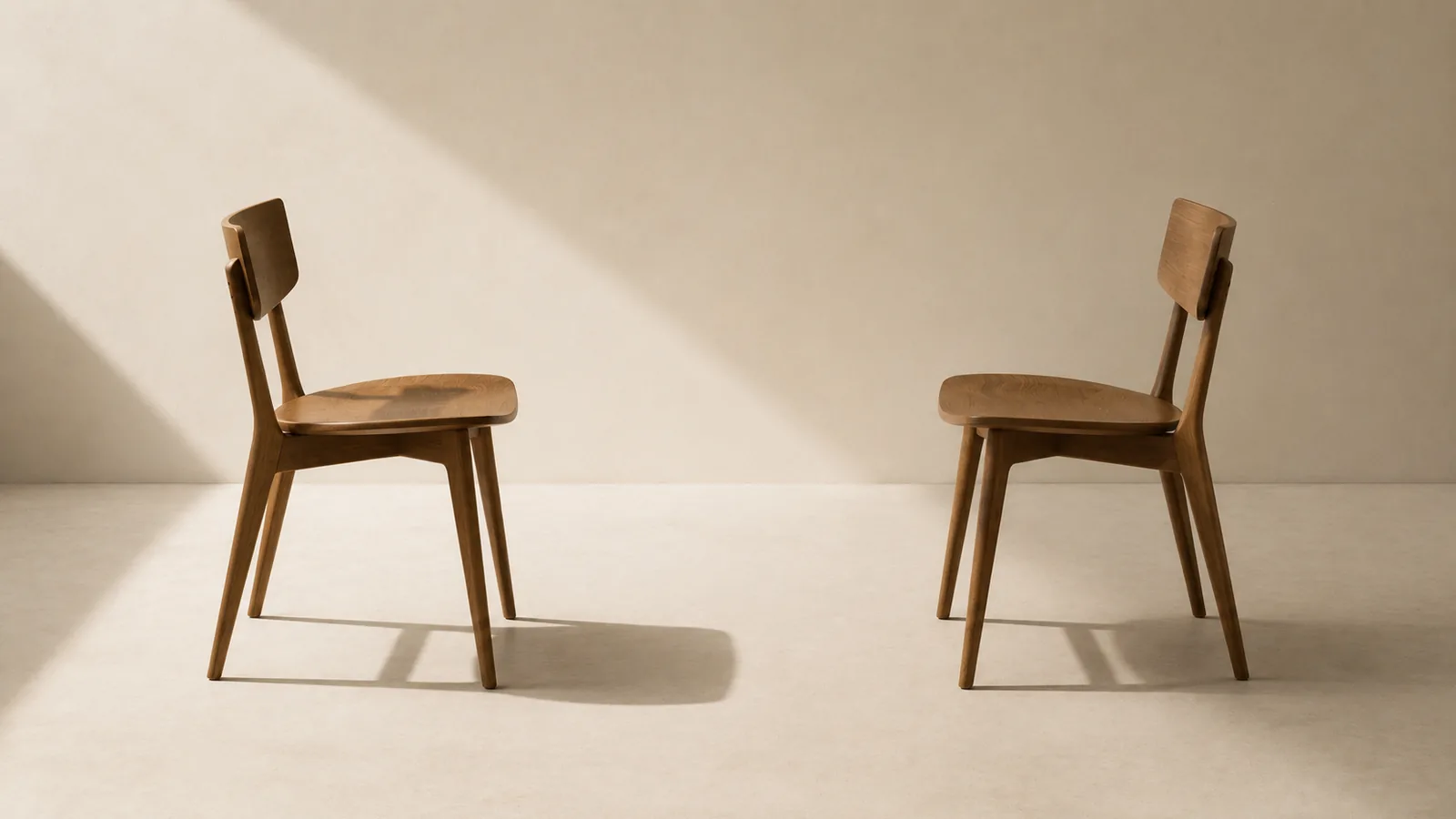 Two identical chairs facing each other at matching angles.