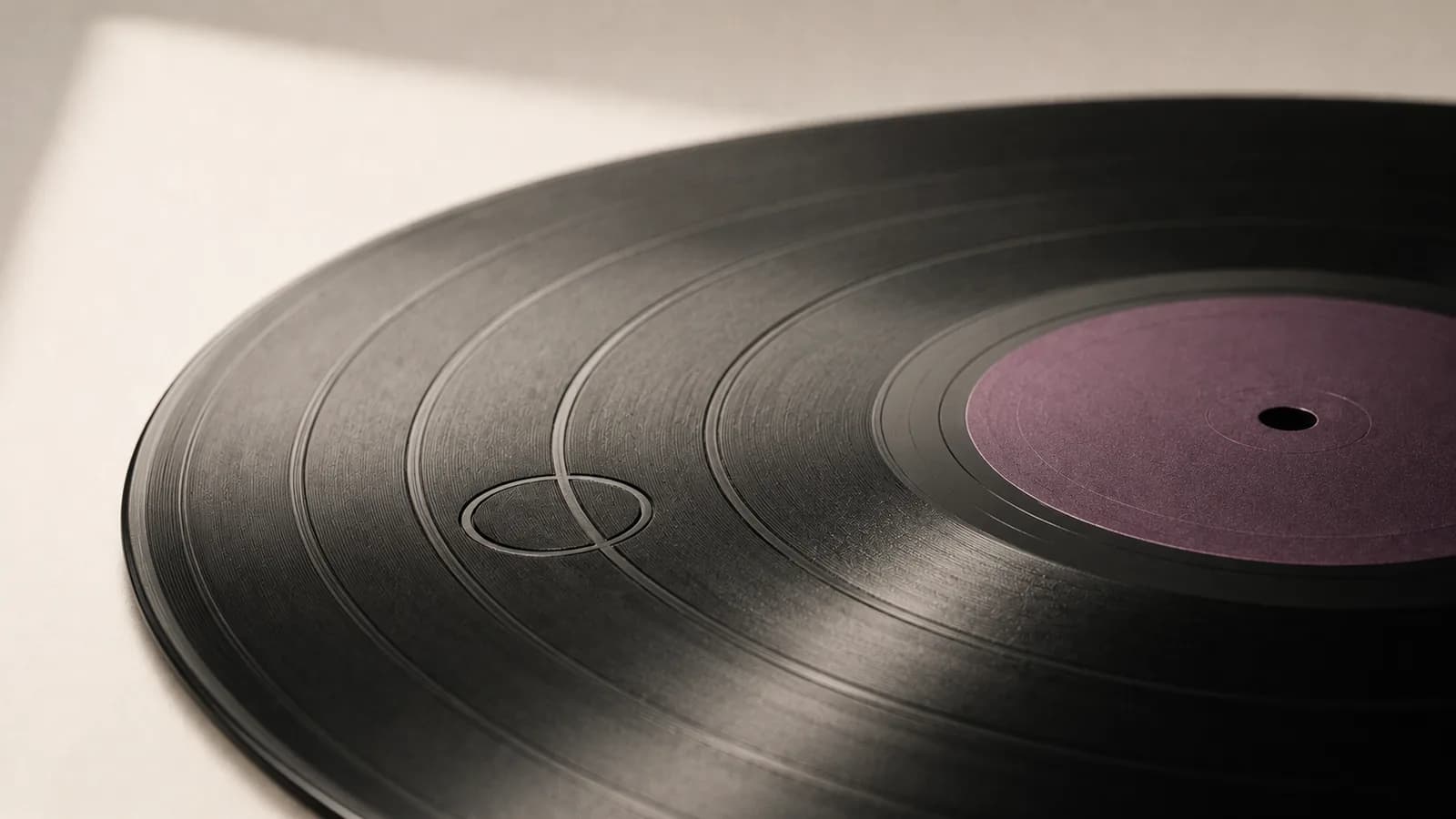 A vinyl record with one groove looping back into itself.